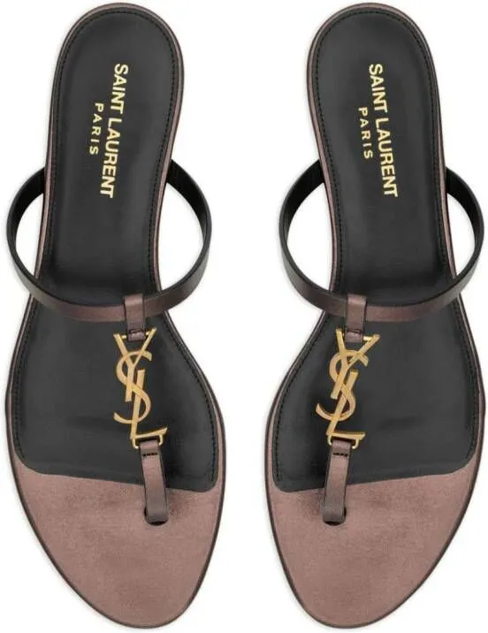 Saint Laurent Cassandra leather flip flops Brown